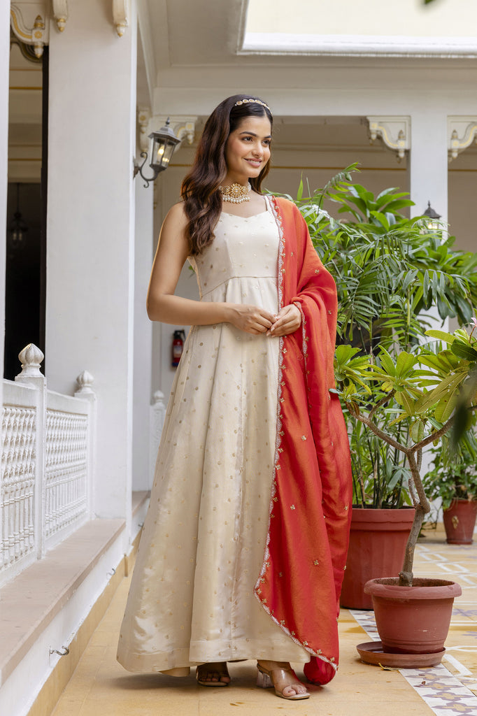 Moonlit Ivory Tissue Silk Sequins Embroidered Anarkali Gown with Churidar Pant & Vibrant Orange Dupatta